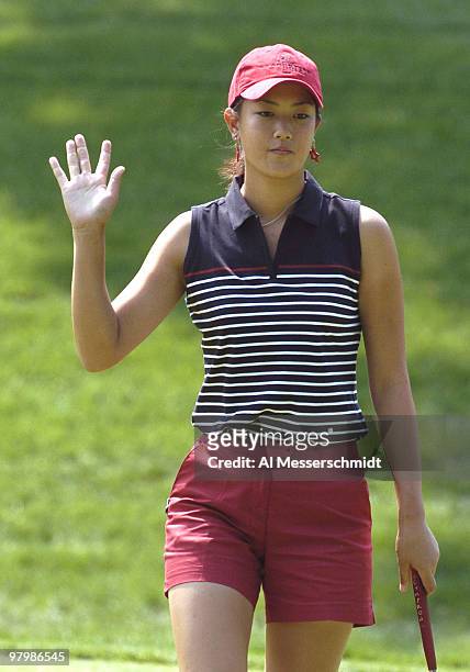 Michelle Wie waives to fans during the final round of the LPGA Michelob Ultra Open in Williamsburg, Virginia, May 9, 2004.