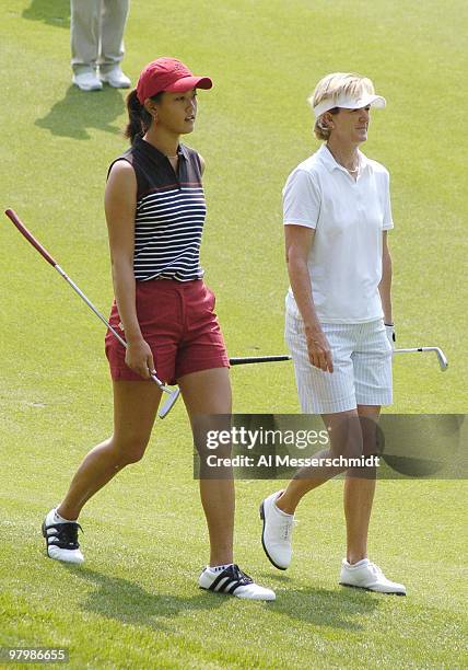 Michelle Wie and Hall of Famer Beth Daniel walk the eighth fairway during the final round of the LPGA Michelob Ultra Open in Williamsburg, Virginia,...