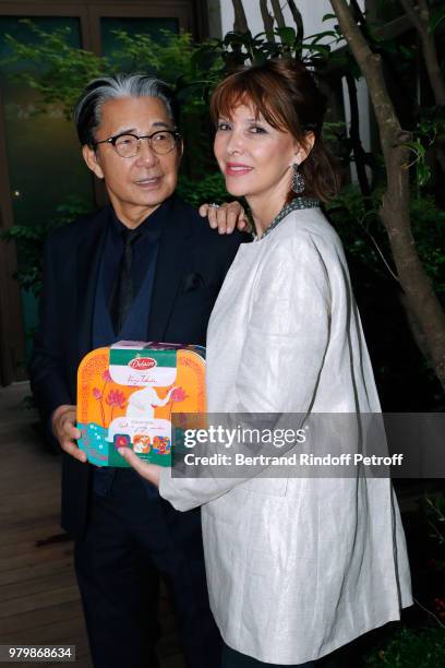 Stylist Kenzo Takada and Creator of the Association "Toutes a l'Ecole" Tina Kieffer attend the "Lost in the jungle paradise" - Delacre Collection...