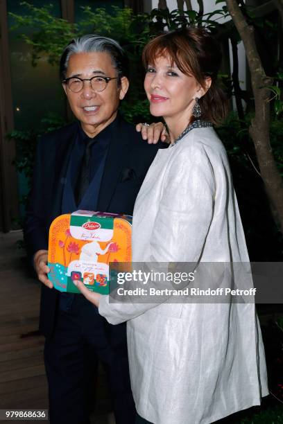 Stylist Kenzo Takada and Creator of the Association "Toutes a l'Ecole" Tina Kieffer attend the "Lost in the jungle paradise" - Delacre Collection...