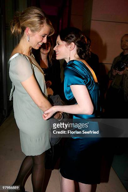 Host Nina Eichinger and actress Karoline Herfurth attend the 'Deutscher Hoerfilmpreis 2010' at the atrium of the German Bank on March 23, 2010 in...
