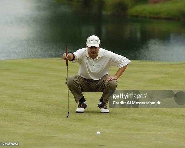 Loren Roberts lines up a putt a putt during first-round play at the FedEx St. Jude Classic May 27, 2004 at the Tournament Players Club Southwind,...
