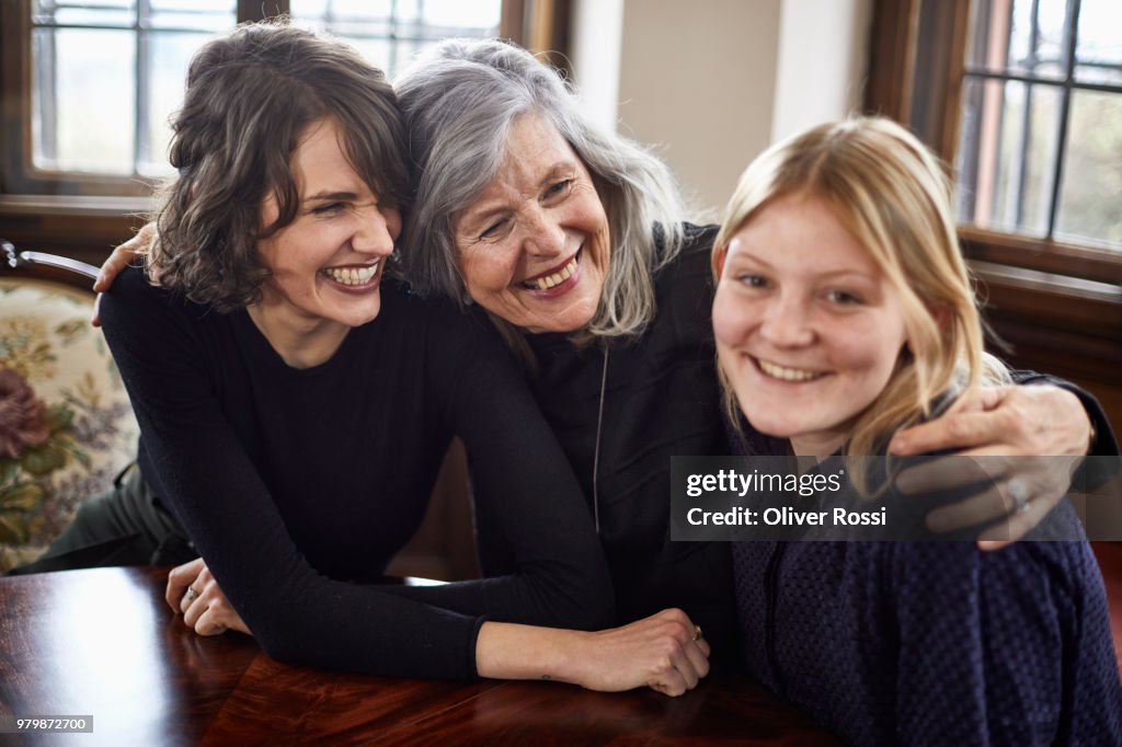 Portrait of happy older and two younger women