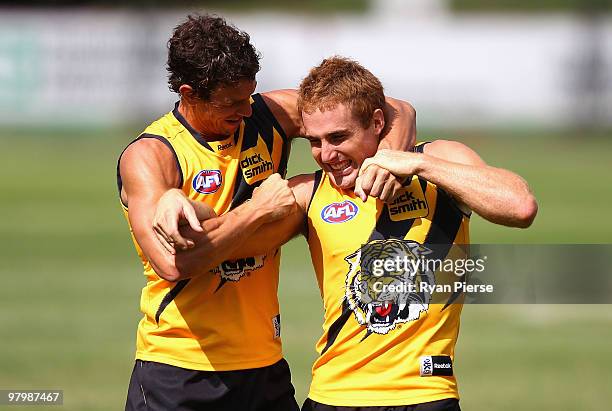 Daniel Jackson and Troy Simmonds of the Tigers wrestle during a Richmond Tigers AFL training session at Punt Road Oval on March 24, 2010 in...