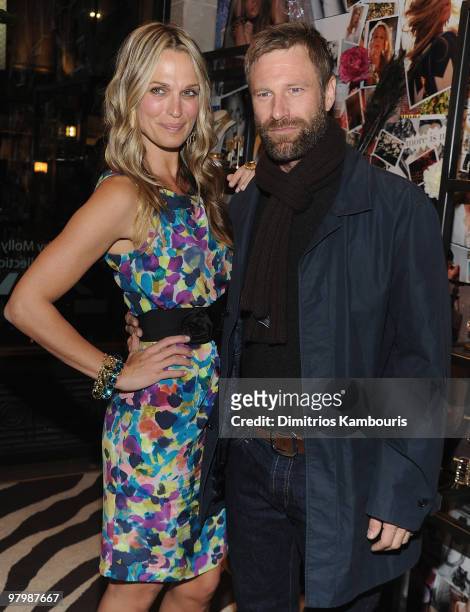 Molly Sims and Aaron Eckhart attend the "Grayce by Molly Sims the Collection" launch at Henri Bendel on March 23, 2010 in New York City.