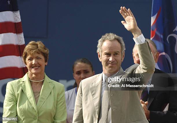 Commentator John McEnroe is introduced as an inductee into the Court of Champions before the men's singles final September 12, 2004 at the 2004 US...