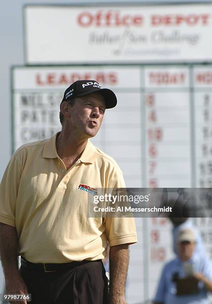 Winner Larry Nelson tosses a kiss to his son, Drew, after a birdie putt on the 13th hole during final-round play in the Office Deport Father/Son...