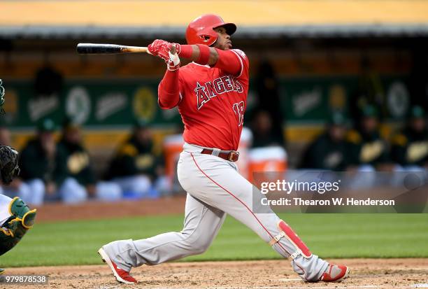 Luis Valbuena of the Los Angeles Angels of Anaheim bats against the Oakland Athletics in the top of the third inning at the Oakland Alameda Coliseum...