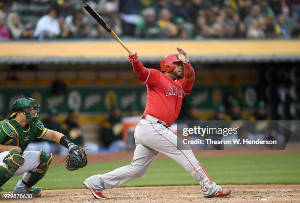 Luis Valbuena of the Los Angeles Angels of Anaheim bats against the Oakland Athletics in the top of the third inning at the Oakland Alameda Coliseum...