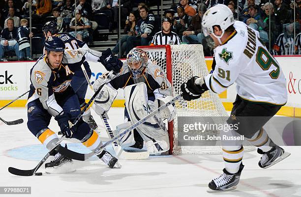 Goalie Pekka Rinne of the Nashville Predators watches as teammate Shea Weber blocks a shot by Brad Richards of the Dallas Stars on March 23, 2010 at...