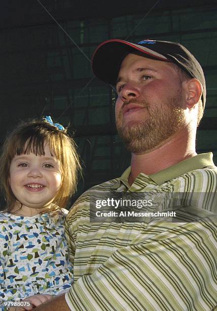 Winner Drew Nelson hugs his four-year-old daughter Ariel after final-round play in the Office Deport Father/Son Challenge at ChampionsGate Resort...