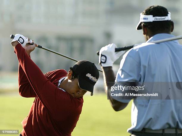 Qass Singh, son of Vijay, works on his swing before final-round play in the Office Deport Father/Son Challenge at ChampionsGate Resort near Orlando,...