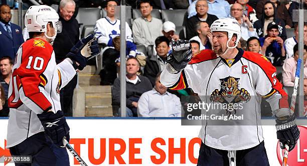 David Booth and Bryan McCabe of the Florida Panthers celebrate a third-period goal against the Toronto Maple Leafs during game action March 23, 2010...