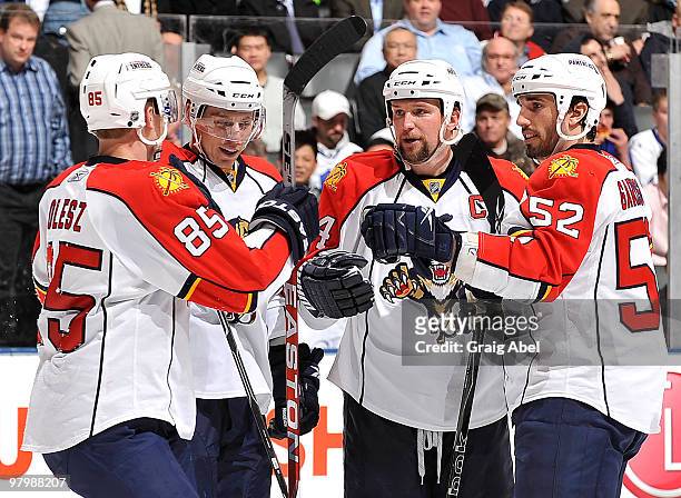 Rostislav Olesz, David Booth, Bryan McCabe and Jason Garrison of the Florida Panthers celebrate a third-period goal against the Toronto Maple Leafs...