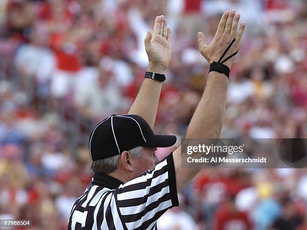 An NCAA football official signals a touchdown at the 2005 Outback Bowl January 1, 2005 at Raymond James Stadium, Tampa, Florida. Georgia defeated...