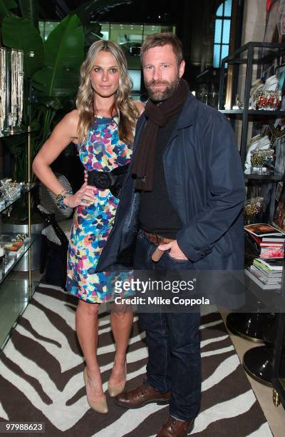 Model/actress Molly Sims and actor Aaron Eckhart attends "Grayce by Molly Sims the Collection" at Henri Bendel on March 23, 2010 in New York City.