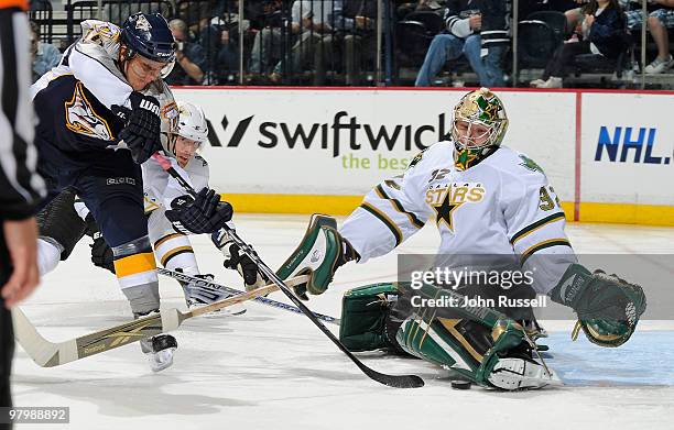 Martin Erat of the Nashville Predators takes a shot on goalie Kari Lehtonen of the Dallas Stars on March 23, 2010 at the Bridgestone Arena in...