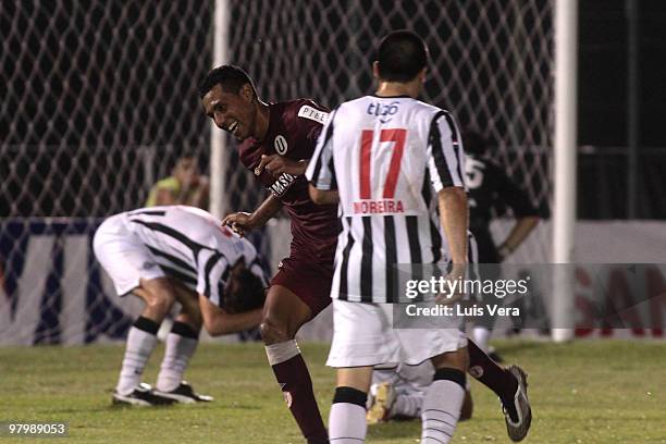 Luis Ramirez of Peruvian Universitario de Lima celebrates after scoring a goal against Paraguay?s Libertad in a Copa Santander Libertadores de...