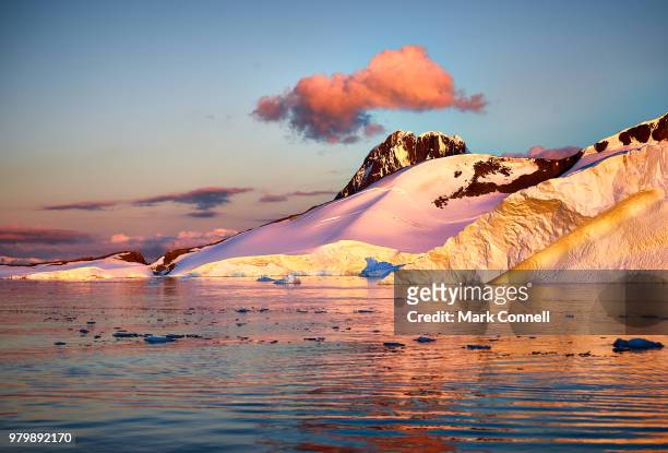 sunset over pleneau bay glacier, antarctica - antarctica sunset stock pictures, royalty-free photos & images