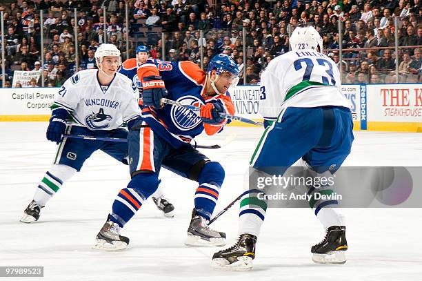 Andrew Cogliano of the Edmonton Oilers takes a shot, which became a second-period goal, against the Vancouver Canucks at Rexall Place on March 23,...