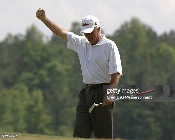 Curtis Strange sinks a birdie putt on the ninth hole during the Regions Charity Classic Charter Communications Pro-Am at Robert Trent Jones Golf...