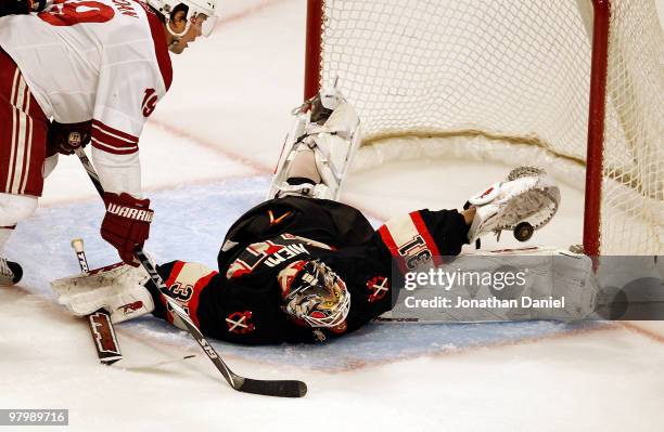 Antti Niemi of the Chicago Blackhawks makes a save in third period in front of Shane Doan of the Phoenix Coyotes on his way to a shut-out at the...