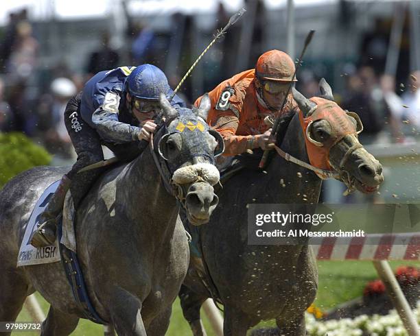 Jockey Ryan Fogelsonger rides Johns Rush battles Edgar Prado aboard Due during the fourth race before the 2006 Preakness at Pimlico in Baltimore, May...