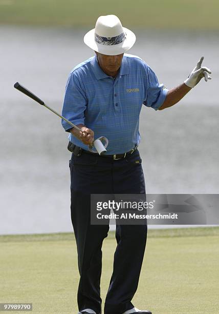 Chi Chi Rodriguez celebrates a birdie putt on the ninth green during the Regions Charity Classic Charter Communications Pro-Am at Robert Trent Jones...