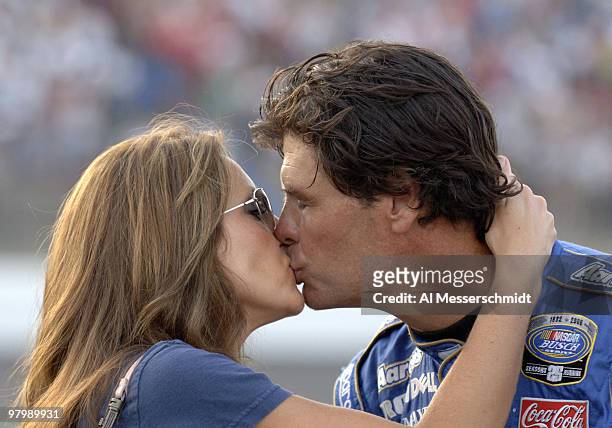Michael Waltrip receives a good luck kiss from his wife, Buffy, before starting the Carquest Auto Parts 300 Busch series race on May 26, 2006 at...