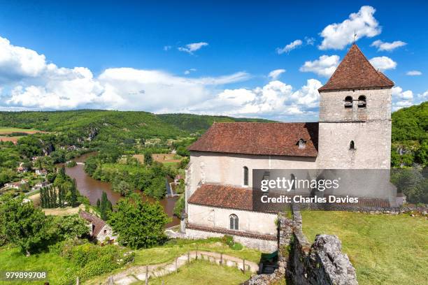 old medieval church on cliff, saint-cirq-lapopie, france - lot river stock pictures, royalty-free photos & images