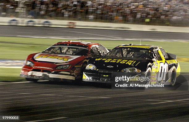 Busch cars race side by side from the pits at the Carquest Auto Parts 300 Busch series race on May 26, 2006 at Lowe's Motor Speedway in Charlotte,...