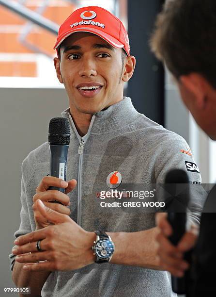 Formula One driver Lewis Hamilton answers a question during a press conference following a media photo opportunity on the former America's Cup yacht...