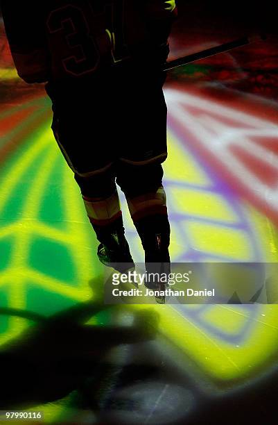 Adam Burish of the Chicago Blackhawks skates onto the ice before a game against the Phoenix Coyotes at the United Center on March 23, 2010 in...