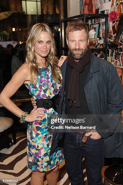 Actress and model Molly Sims and actor Aaron Eckhart promote "Grayce by Molly Sims the Collection" at Henri Bendel on March 23, 2010 in New York City.