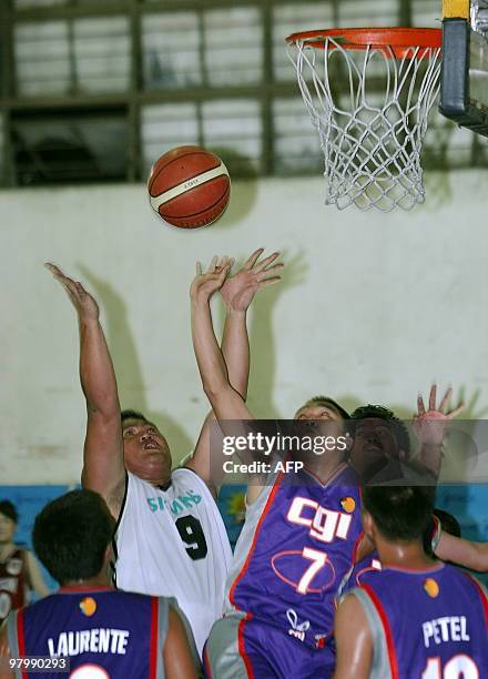 Basket-Philippines-Lifestyle-PHI,FEATURE, by Mynardo Macaraig Bsketball players jump to retrieve the ball during a Below Six Feet Basketball League...