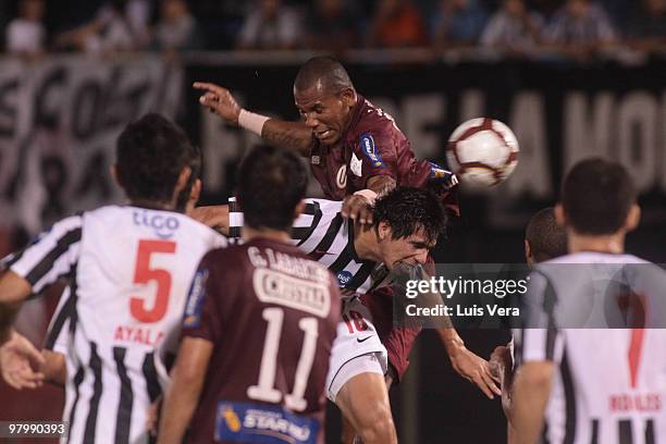 Peruvian Universitario de Lima's Luis Ramirez vies for the ball with Victor Caceres of Paraguay?s Libertad during their Copa Santander Libertadores...