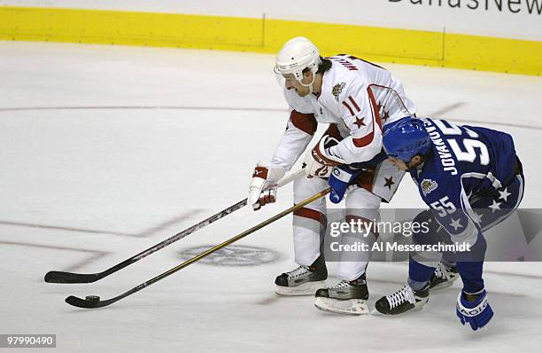 Phoenix defenseman Ed Jovanovski battles Carolina forward Justin Williams for the puck the 2007 NHL All-Star game January 24, 2007 at the American...