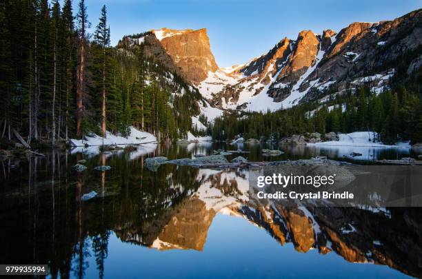 mountains reflecting in lake in rocky mountain national park, colorado, usa - brindle stock pictures, royalty-free photos & images