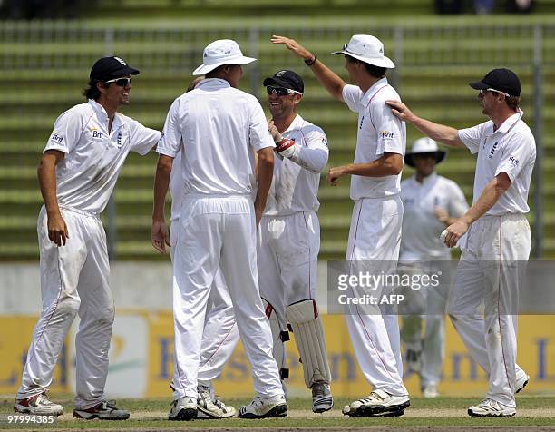 England cricketers congratulate teammate Matt Prior for dismissing Bangladeshi captain Shakib Al Hasan during the fifth and last day of the second...
