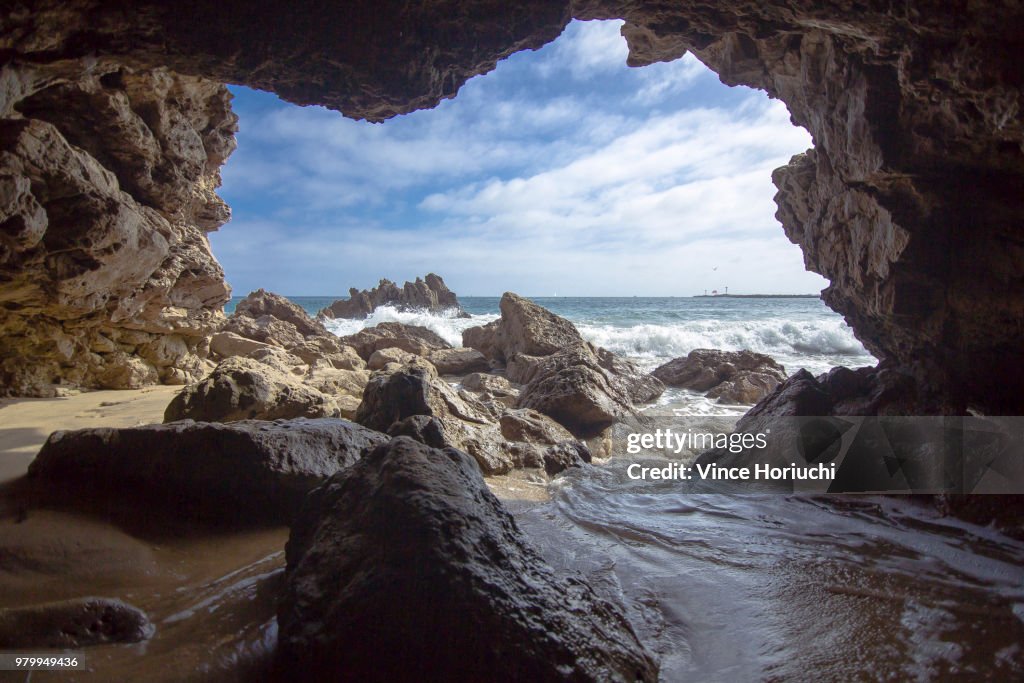 View from out of cave on seashore, Newport Beach, California, USA