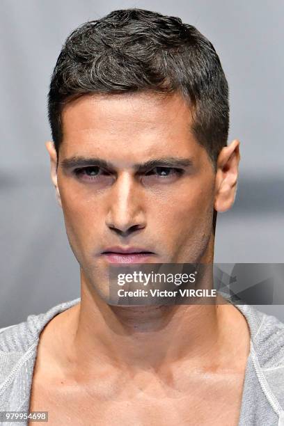 Model walks the runway at the Giorgio Armani fashion show during Milan Men's Fashion Week Spring/Summer 2019 on June 18, 2018 in Milan, Italy.