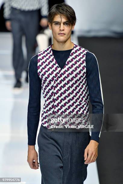 Model walks the runway at the Giorgio Armani fashion show during Milan Men's Fashion Week Spring/Summer 2019 on June 18, 2018 in Milan, Italy.