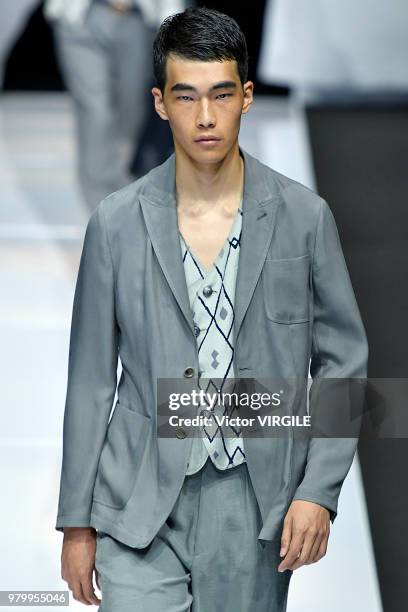 Model walks the runway at the Giorgio Armani fashion show during Milan Men's Fashion Week Spring/Summer 2019 on June 18, 2018 in Milan, Italy.