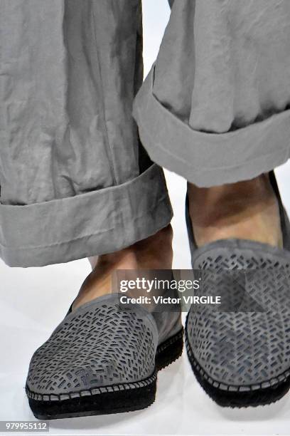 Model walks the runway at the Giorgio Armani fashion show during Milan Men's Fashion Week Spring/Summer 2019 on June 18, 2018 in Milan, Italy.