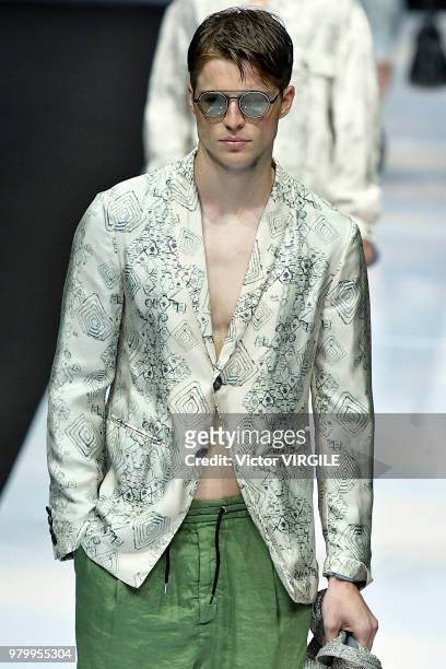 Model walks the runway at the Giorgio Armani fashion show during Milan Men's Fashion Week Spring/Summer 2019 on June 18, 2018 in Milan, Italy.
