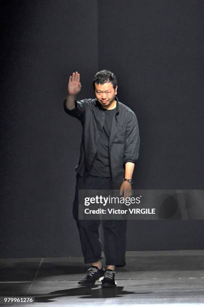 Fashion designer Yosuke Aizawa walks the runway at the Hunting World fashion show during Milan Men's Fashion Week Spring/Summer 2019 on June 18, 2018...