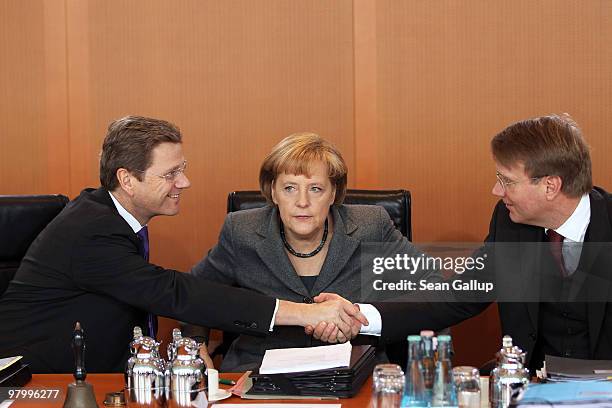 German Chancellor Angela Merkel, Vice Chancellor and Foreign Minister Guido Westerwelle and Minister of the Chancellery Ronald Pofalla arrive for the...