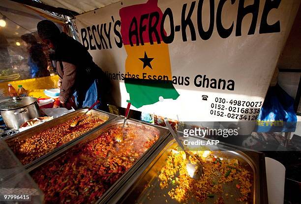 Woman sells food from Ghana at a market on the Maybachufer in Berlin's Neukoelln district on March 9, 2010. The market which is know as the �Turkish...