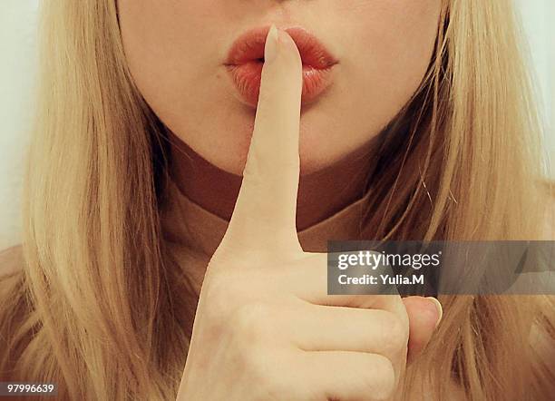 keep quiet sign - finger on lips stock pictures, royalty-free photos & images