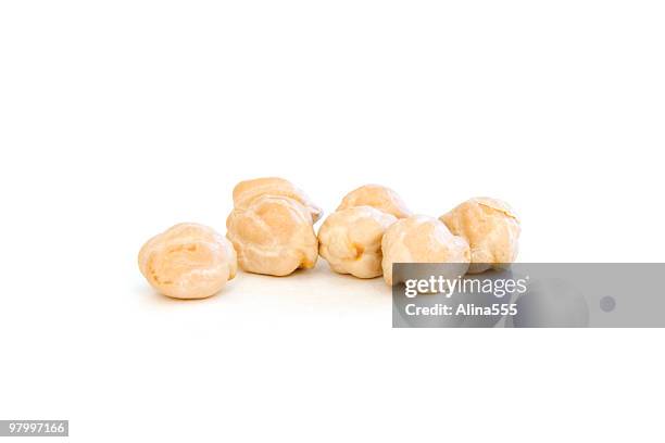 several garbanzo beans on white - chick pea stock pictures, royalty-free photos & images